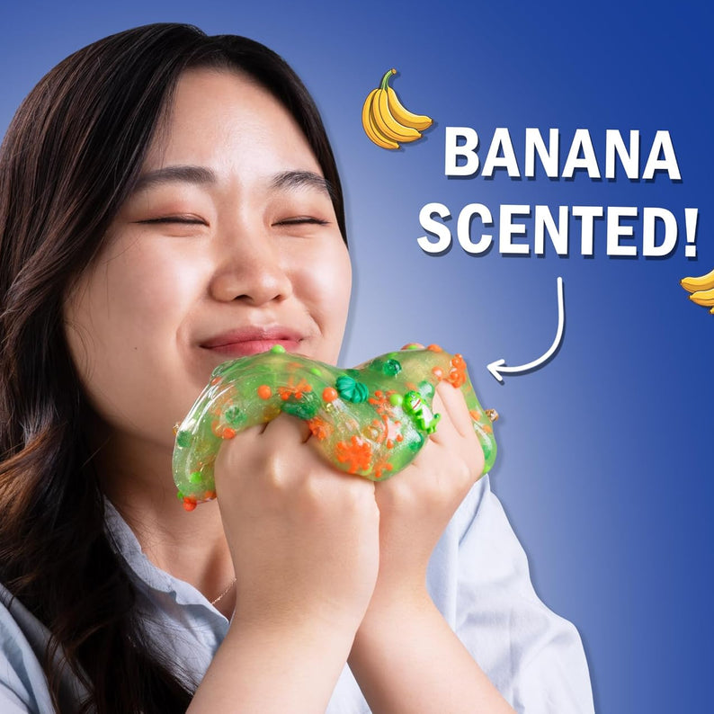 Crazy Aaron’s Slime Charmers - Dino Dew, Banana Scented Slime with Charms, Non-Toxic, Super Stretchy & Squishy Fidget Toy Suitable for Boys and Girls Aged 3Y+