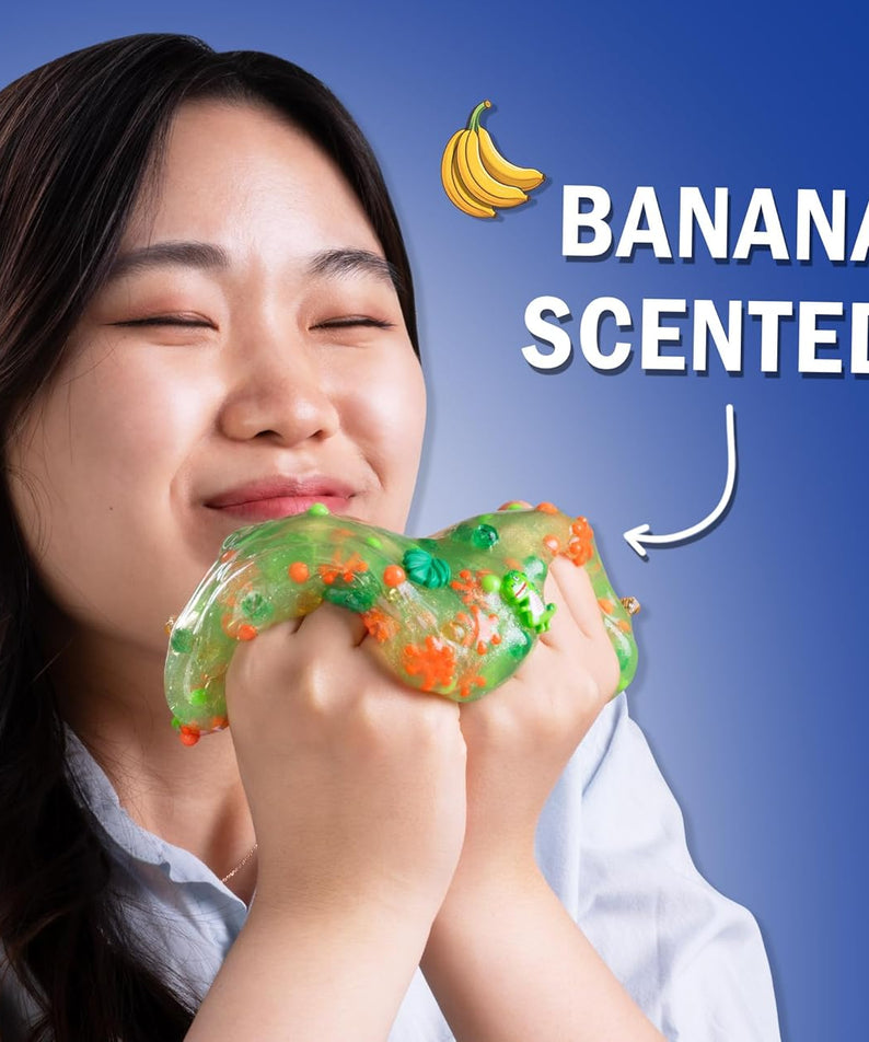 Crazy Aaron’s Slime Charmers - Dino Dew, Banana Scented Slime with Charms, Non-Toxic, Super Stretchy & Squishy Fidget Toy Suitable for Boys and Girls Aged 3Y+